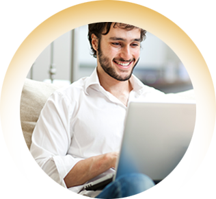 smiling man using laptop